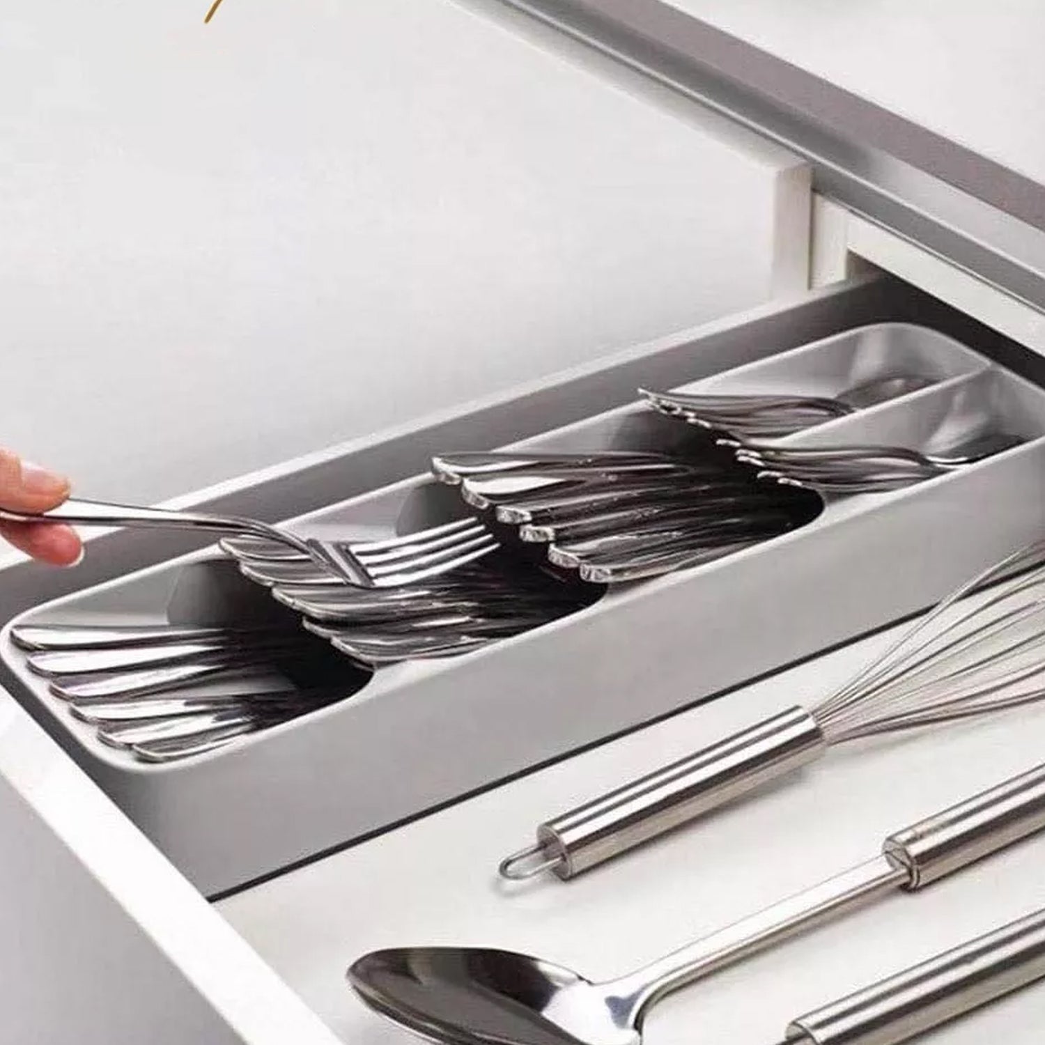 Cutlery tray box neatly arranged with different utensil types Cutlery tray box neatly arranged with different utensil types